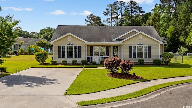 single story home with a porch and a shingled roof