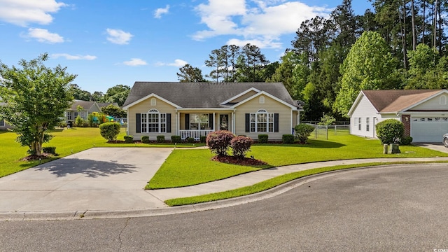 single story home with a porch and concrete driveway