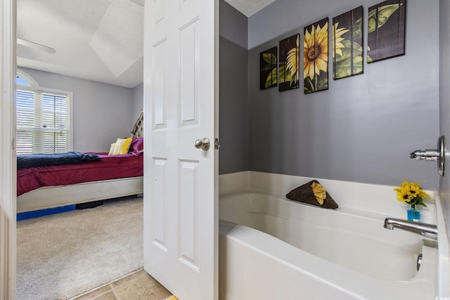 ensuite bathroom with a garden tub