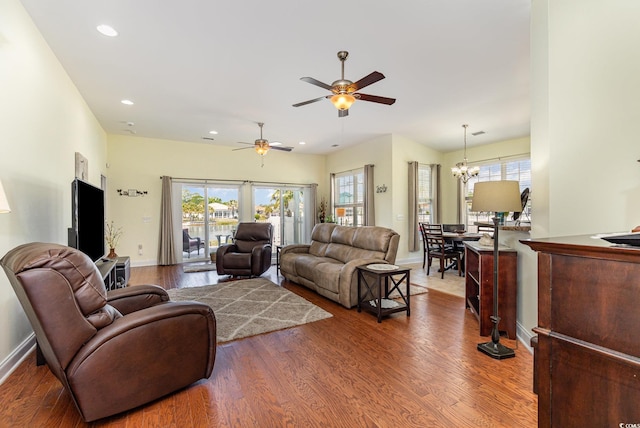 2940 Tigers Eye Rd, Little River, SC 29566 - living room featuring ceiling fan, healthy amount of natural light, wood finished floors, baseboards, and recessed lighting