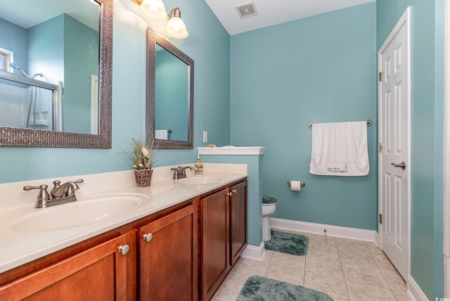 2940 Tigers Eye Rd, Little River, SC 29566 - full bath with double vanity, toilet, baseboards, an enclosed shower, and tile patterned flooring