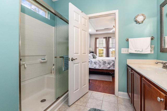 2940 Tigers Eye Rd, Little River, SC 29566 - ensuite bathroom with a shower stall, tile patterned floors, ceiling fan, vanity, and baseboards