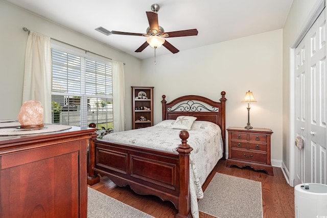 2940 Tigers Eye Rd, Little River, SC 29566 - bedroom with a closet, wood finished floors, a ceiling fan, and baseboards