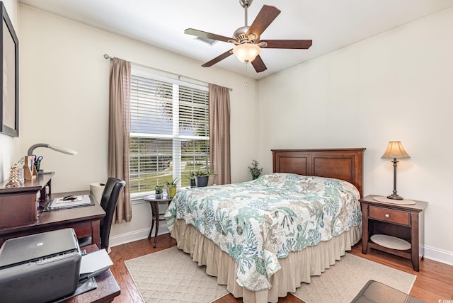 2940 Tigers Eye Rd, Little River, SC 29566 - bedroom featuring light wood-style floors, baseboards, a desk, and a ceiling fan
