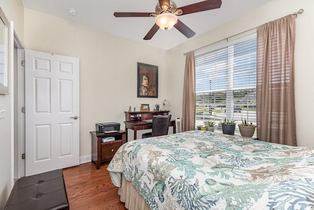 2940 Tigers Eye Rd, Little River, SC 29566 - bedroom with wood finished floors, a ceiling fan, and baseboards