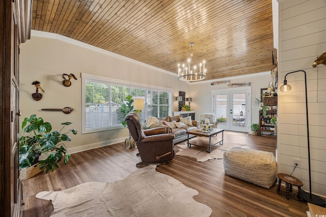 living room with a notable chandelier, french doors, baseboards, wood ceiling, and wood finished floors