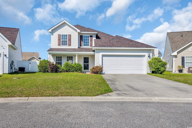 381 Winslow Ave, Myrtle Beach, SC 29588 - traditional-style home with fence, a front yard, an attached garage, central air condition unit, and driveway