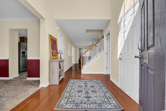 381 Winslow Ave, Myrtle Beach, SC 29588 - entrance foyer with dark wood finished floors, baseboards, stairs, and visible vents