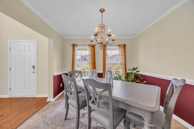 381 Winslow Ave, Myrtle Beach, SC 29588 - dining space with baseboards, a notable chandelier, ornamental molding, and light wood-type flooring