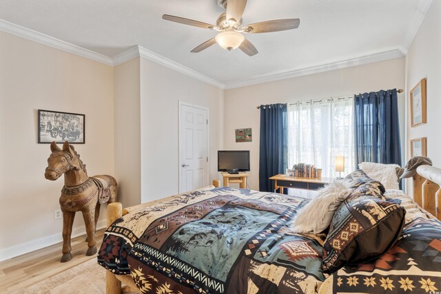 bedroom featuring crown molding, a ceiling fan, baseboards, and wood finished floors