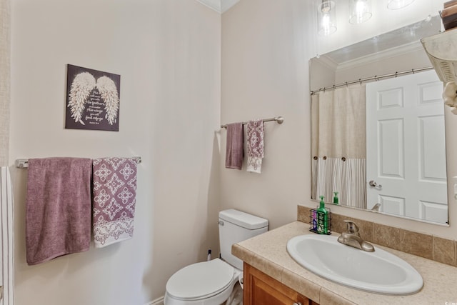 bathroom featuring toilet, ornamental molding, curtained shower, and vanity