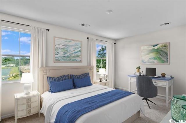 carpeted bedroom with baseboards and visible vents