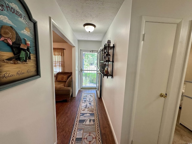 801 Talbot Cir, Myrtle Beach, SC 29577 - hall with a textured ceiling, wood finished floors, and baseboards