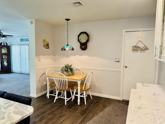 801 Talbot Cir, Myrtle Beach, SC 29577 - dining space with dark wood-style flooring, a ceiling fan, and baseboards