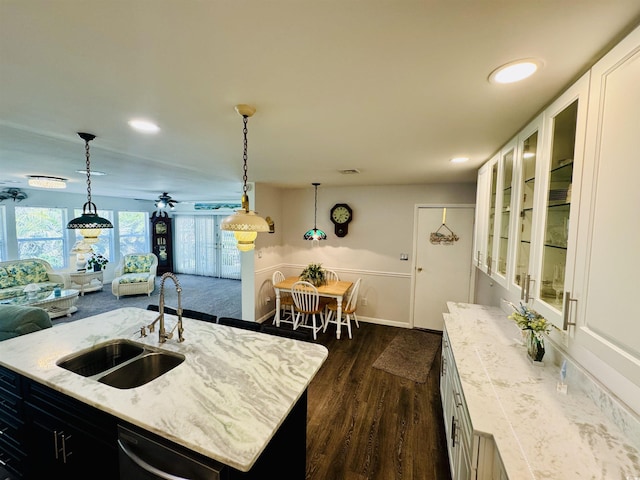 801 Talbot Cir, Myrtle Beach, SC 29577 - kitchen featuring a sink, dark wood-style flooring, healthy amount of natural light, light stone countertops, and recessed lighting