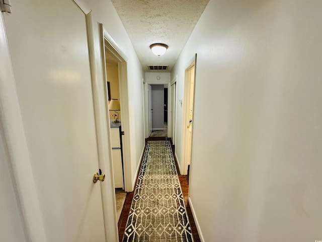 801 Talbot Cir, Myrtle Beach, SC 29577 - hallway with a textured ceiling and baseboards
