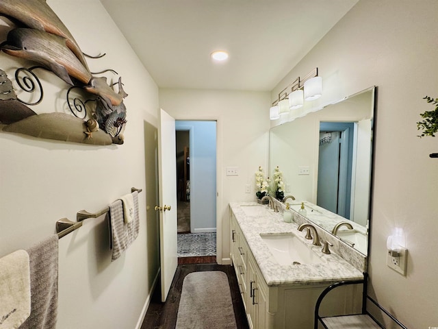 801 Talbot Cir, Myrtle Beach, SC 29577 - bathroom with wood finished floors, double vanity, baseboards, and recessed lighting