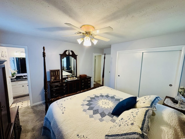 801 Talbot Cir, Myrtle Beach, SC 29577 - carpeted bedroom featuring a closet, a textured ceiling, a ceiling fan, connected bathroom, and baseboards