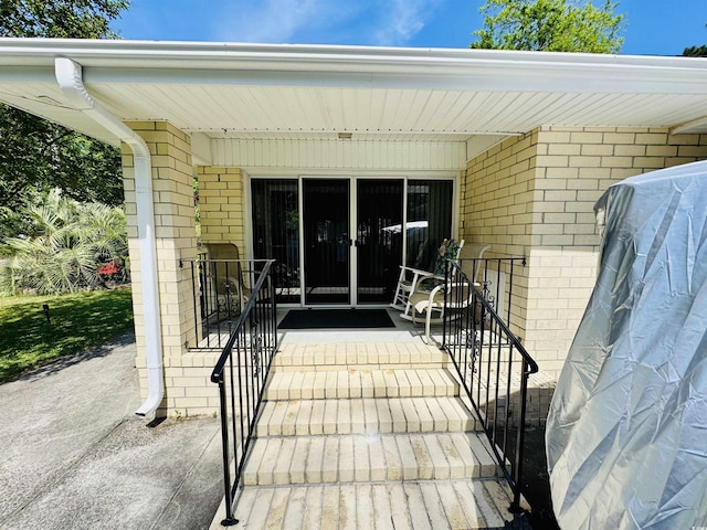 801 Talbot Cir, Myrtle Beach, SC 29577 - view of exterior entry featuring brick siding and a porch