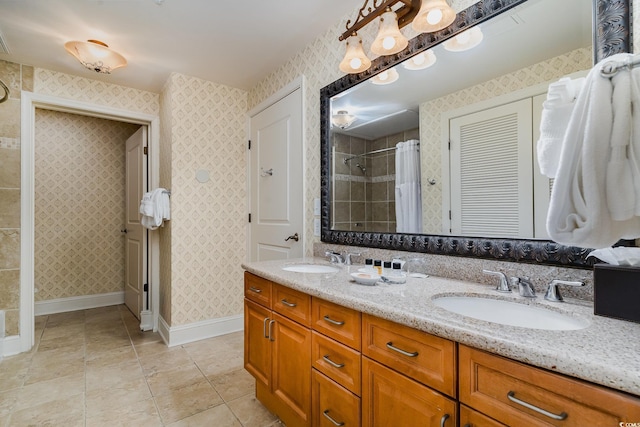 8121 Amalfi Pl Unit 4-801, Myrtle Beach, SC 29572 - bathroom featuring double vanity, tiled shower, wallpapered walls, and a closet