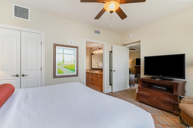 8121 Amalfi Pl Unit 4-801, Myrtle Beach, SC 29572 - bedroom featuring a closet, ensuite bath, a ceiling fan, and light colored carpet