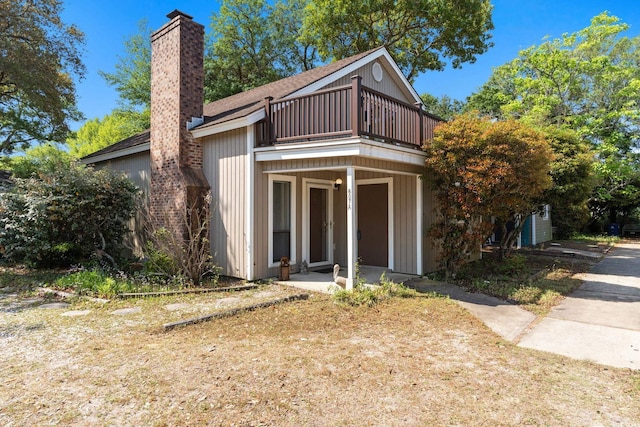 607A 28th Ave S, North Myrtle Beach, SC 29582 - view of front of property with a balcony and a chimney