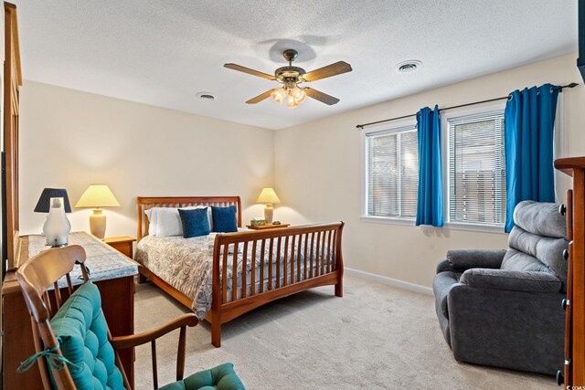 607A 28th Ave S, North Myrtle Beach, SC 29582 - carpeted bedroom with baseboards, a textured ceiling, and ceiling fan