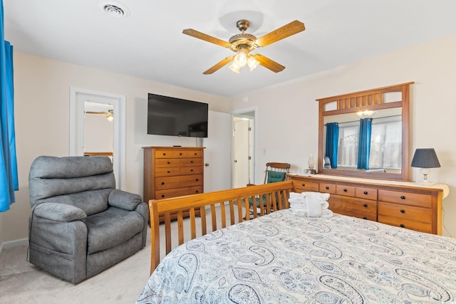 bedroom featuring visible vents, a ceiling fan, and carpet