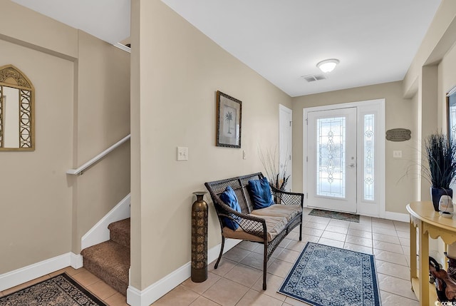 209 Hillside Dr N Unit 104, North Myrtle Beach, SC 29582 - foyer featuring light tile patterned floors, stairs, and baseboards