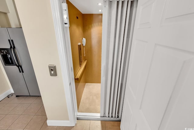 209 Hillside Dr N Unit 104, North Myrtle Beach, SC 29582 - elevator with stainless steel fridge with ice dispenser, baseboards, and recessed lighting
