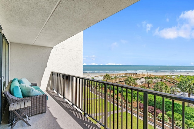 balcony with a view of the beach and a water view