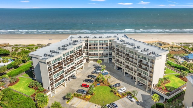 aerial view featuring a view of the beach and a water view