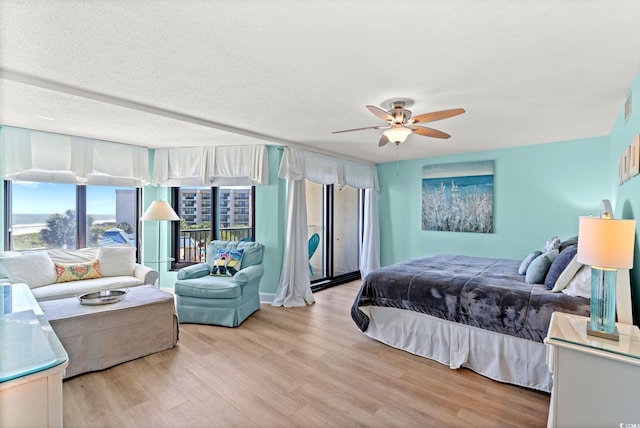 bedroom featuring light wood finished floors and ceiling fan