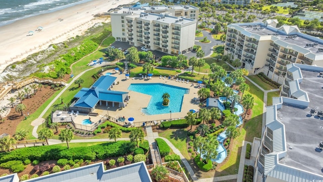 drone / aerial view with a beach view and a water view