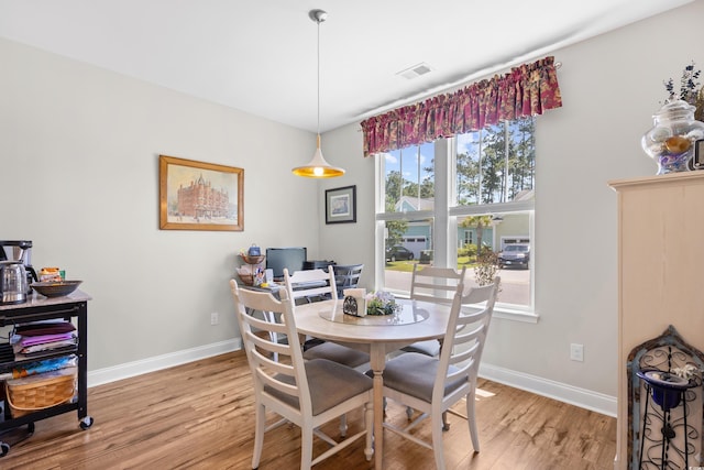 1048 Longwood Bluffs Cir, Murrells Inlet, SC 29576 - dining space with light wood finished floors and baseboards