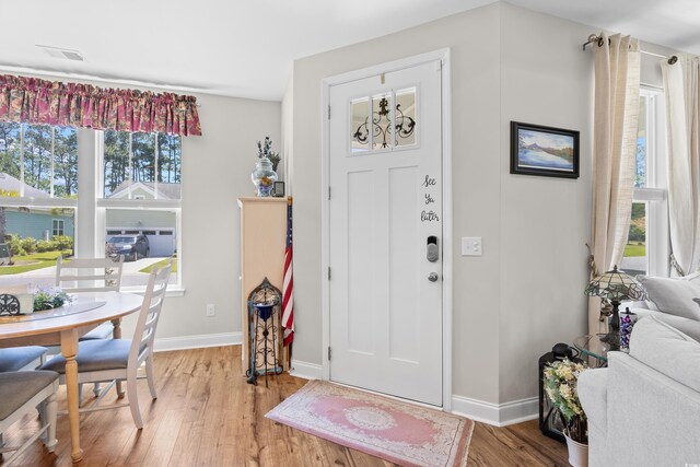 1048 Longwood Bluffs Cir, Murrells Inlet, SC 29576 - entryway with light wood-type flooring and baseboards