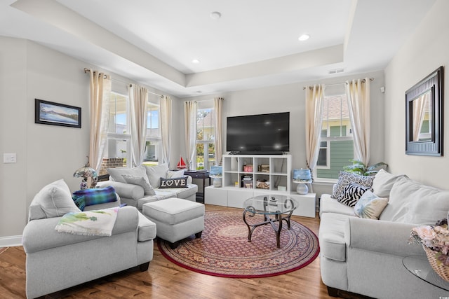 1048 Longwood Bluffs Cir, Murrells Inlet, SC 29576 - living area featuring wood finished floors, a tray ceiling, and recessed lighting