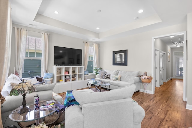 1048 Longwood Bluffs Cir, Murrells Inlet, SC 29576 - living area featuring a tray ceiling, healthy amount of natural light, wood finished floors, and recessed lighting