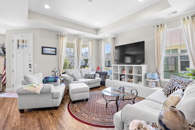 1048 Longwood Bluffs Cir, Murrells Inlet, SC 29576 - living area featuring a raised ceiling, wood finished floors, and recessed lighting
