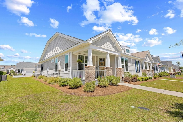 1048 Longwood Bluffs Cir, Murrells Inlet, SC 29576 - view of front of property with covered porch, a front lawn, and a residential view