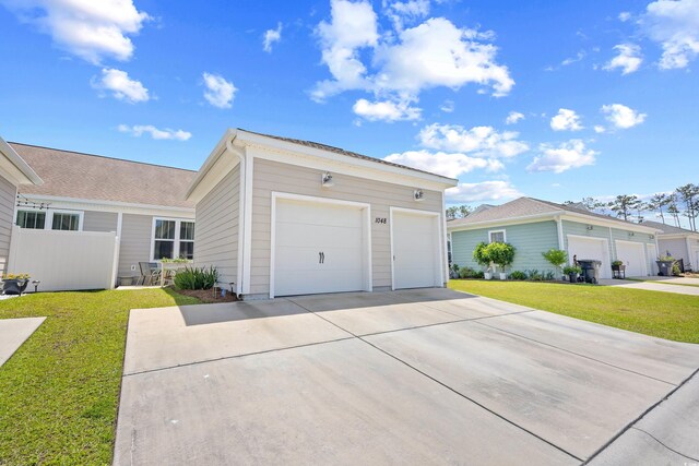 1048 Longwood Bluffs Cir, Murrells Inlet, SC 29576 - ranch-style house with a front lawn, concrete driveway, and an outbuilding