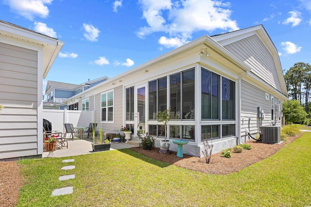 1048 Longwood Bluffs Cir, Murrells Inlet, SC 29576 - back of property with a sunroom, a patio, and central AC unit