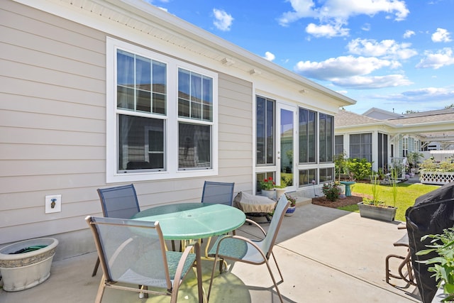 1048 Longwood Bluffs Cir, Murrells Inlet, SC 29576 - view of patio / terrace with outdoor dining area and a sunroom