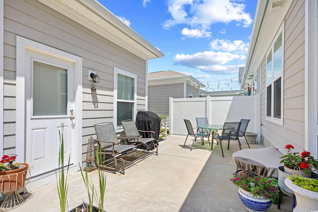 1048 Longwood Bluffs Cir, Murrells Inlet, SC 29576 - view of patio with outdoor dining area, fence, and grilling area