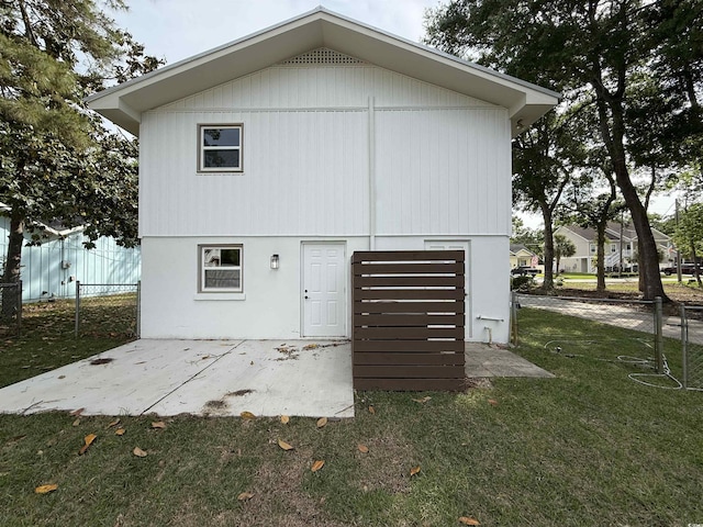 exterior space with a patio area, fence, and a front yard