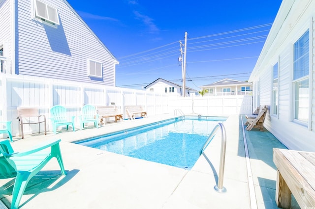 view of swimming pool featuring a fenced backyard, a patio, and a fenced in pool
