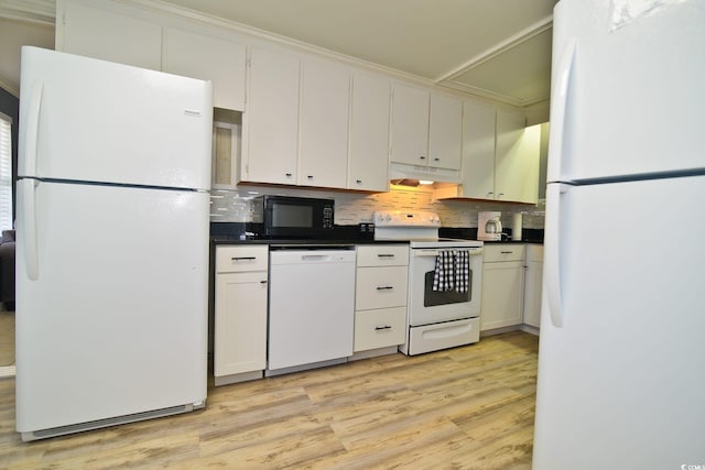 kitchen with white appliances, light wood finished floors, tasteful backsplash, and under cabinet range hood