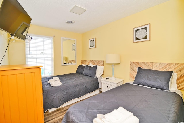 bedroom featuring visible vents