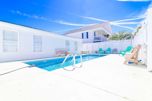 view of swimming pool with a patio area, a fenced in pool, and a fenced backyard