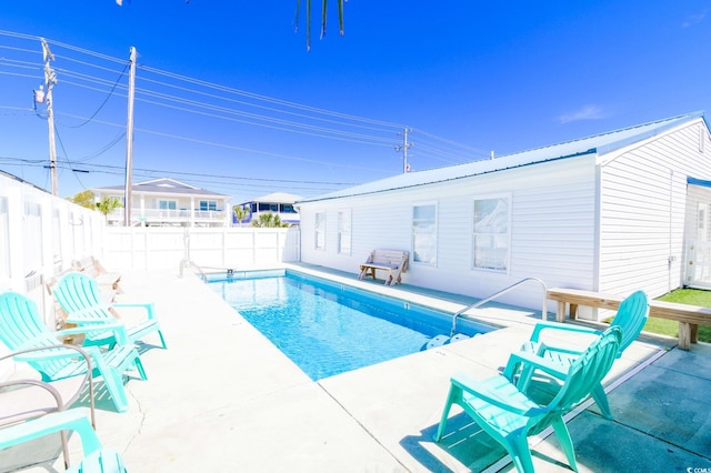 view of pool featuring a patio, a fenced in pool, and a fenced backyard